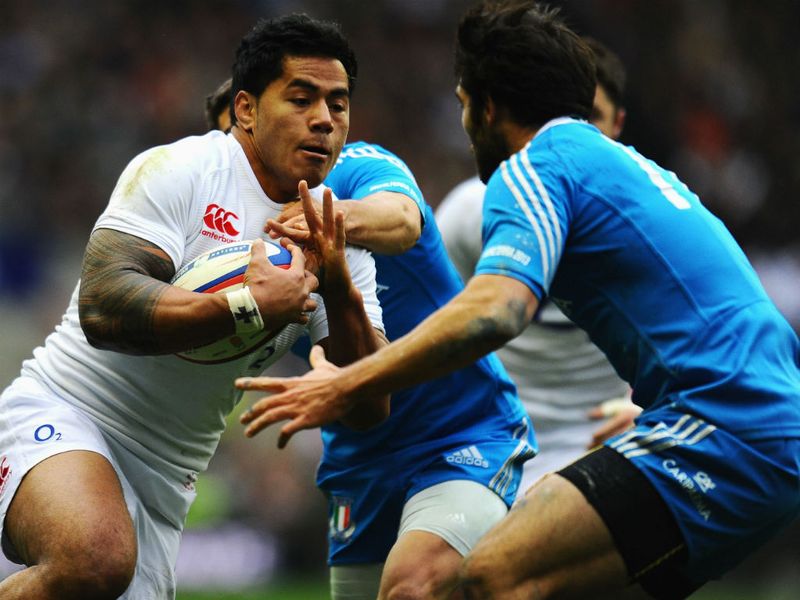 Good battle: Luke McLean of Italy tackles Manu Tuilagi