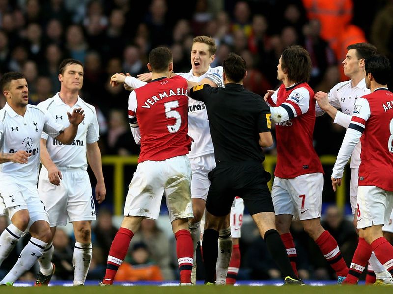 Opposing captains Thomas Vermaelen and Michael Dawson clash as tempers fray down the Lane