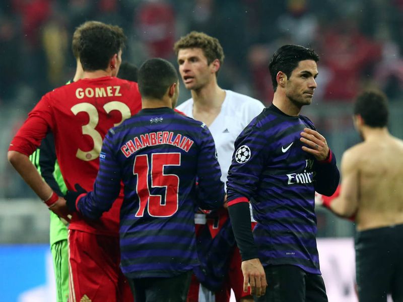 Mikel Arteta is a dejected figure at full-time after Arsenal bow out of the Champions League on away goals after beating Bayern Munich 2-0