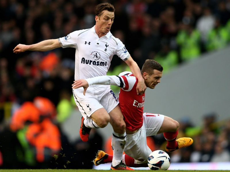 Scott Parker and Jack Wilshere compete for the ball in the middle of the park...