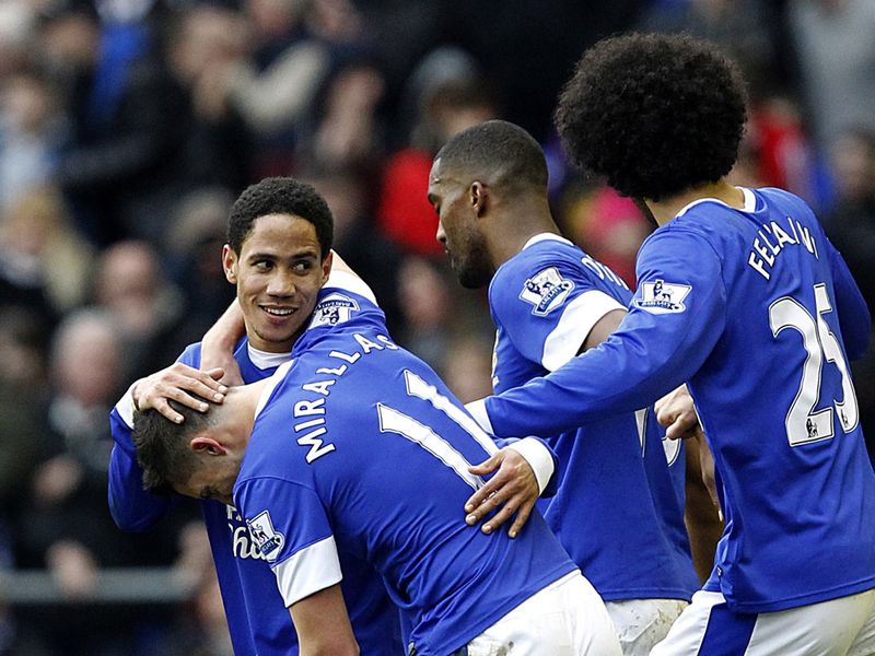 Steven Pienaar is mobbed after doubling Everton's lead