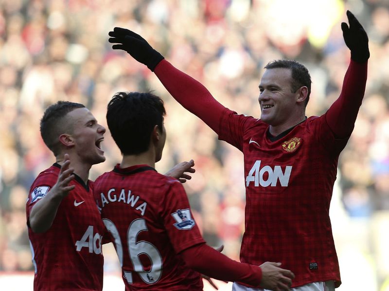 The Manchester United striker is congratulated by his teammates