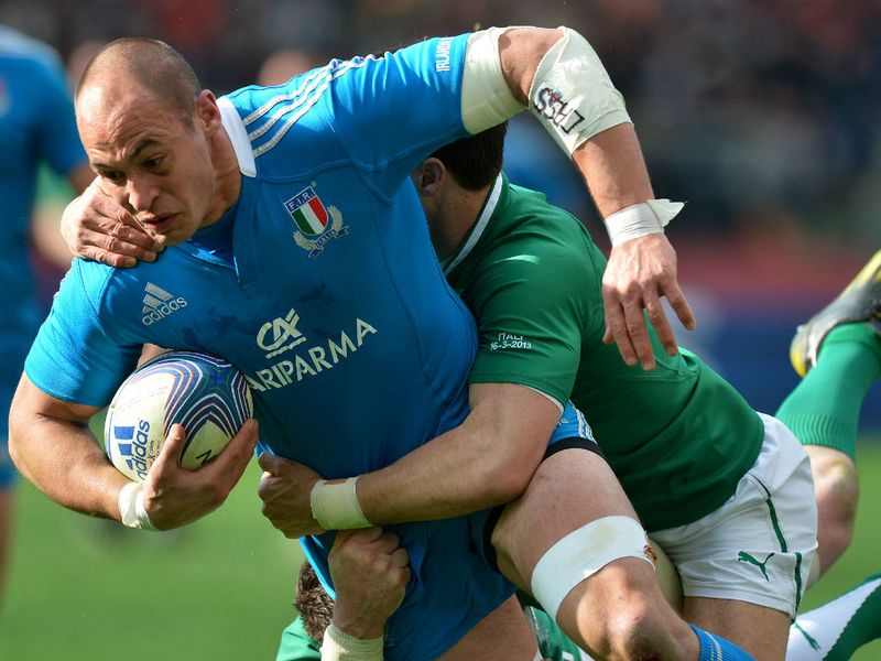 Power house: Italy's skipper Sergio Parisse is tackled by Ireland scrum-half Conor Murray