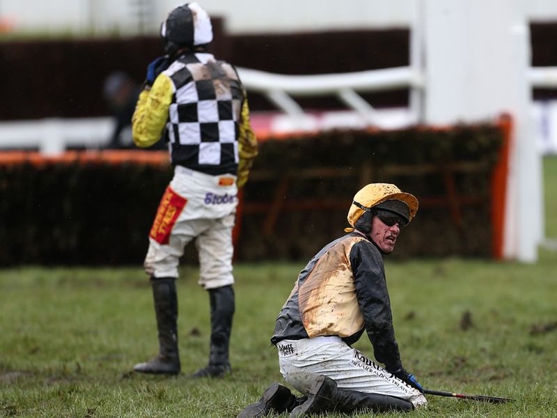 Paul Carberry (right) after a fall in the Albert Bartlett hurdle