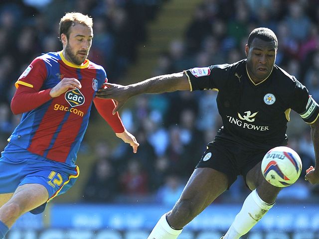 Glenn Murray of Crystal Palace looks to get past Wes Morgan