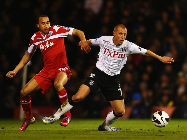 Andros Townsend and Steve Sidwell tangle.