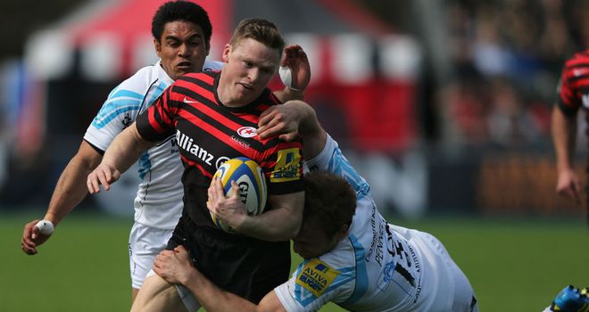 Chris Ashton of Saracens is tackled by Chris Pennel