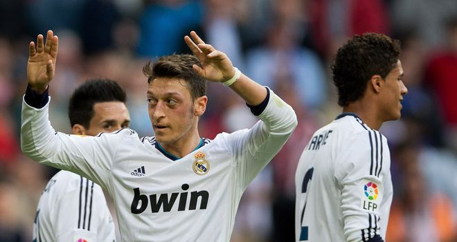 Mesut Ozil celebrates his second goal