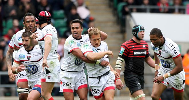 Jonny Wilkinson is mobbed by team-mates after scoring a crucial drop-goal