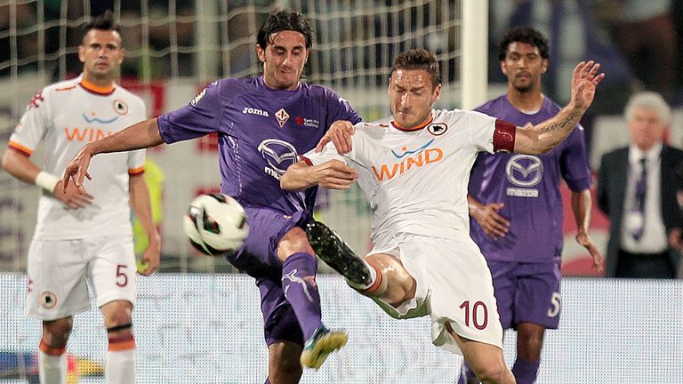 Fiorentina's Alberto Aquilani battles with Francesco Totti