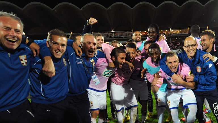 Evian's players and staff celebrate.