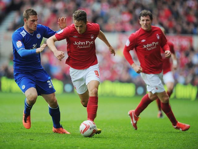 Chris Cohen is tackled by Chris Wood.