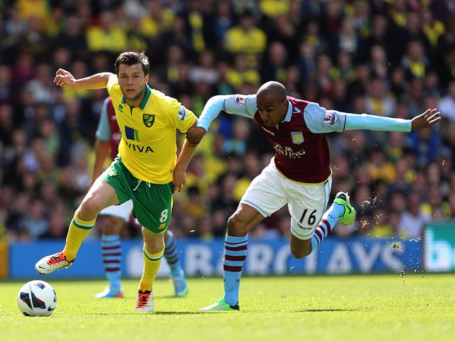 Jonathan Howson and Fabian Delph battle.