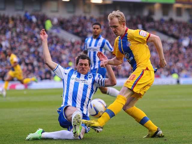 Jonathan Williams is tackled by Gordon Greer.