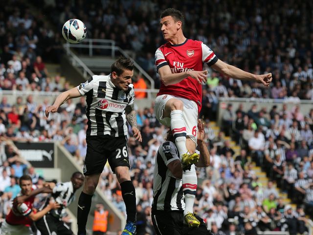 Laurent Koscielny gets a header in.