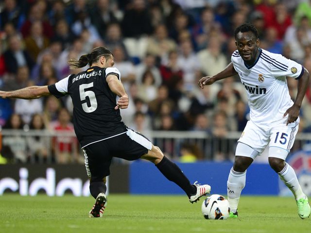 Michael Essien vies with Martin Demichelis.