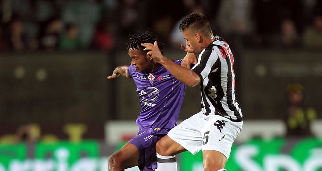 Adrian Calello fights for the ball with Juan Cuadrado.