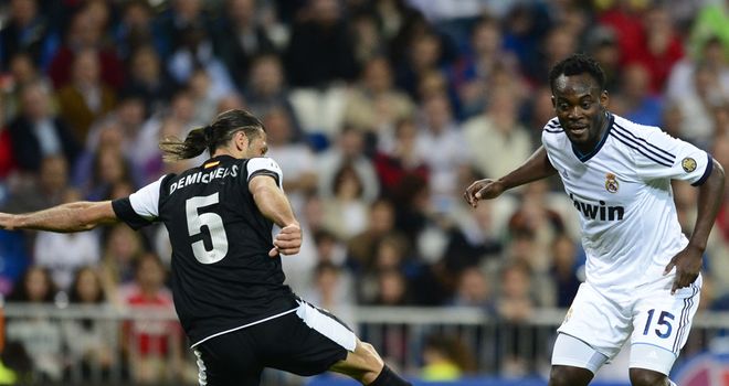 Michael Essien vies with Martin Demichelis.