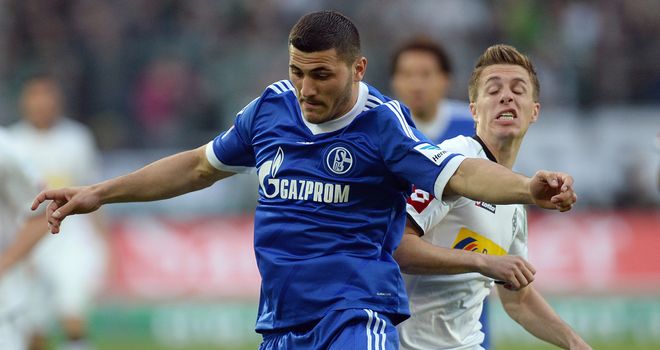Patrick Herrmann and Sead Kolasinac tangle.
