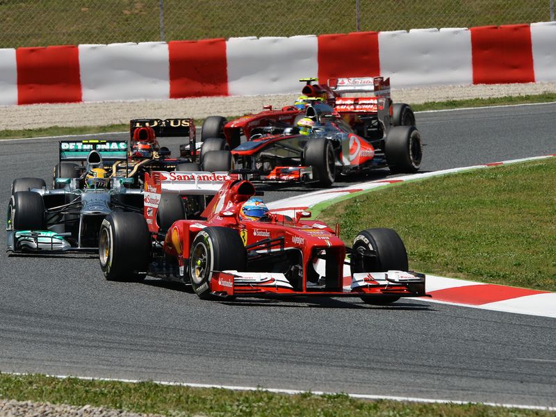 Lewis Hamilton follows Fernando Alonso at the start
