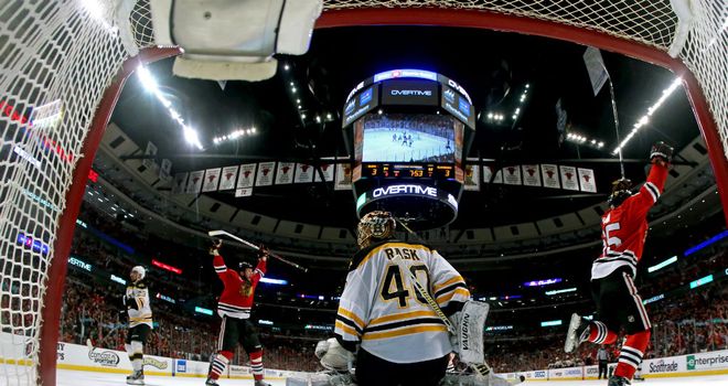 Andrew Shaw (r) celebrates his triple overtime winner