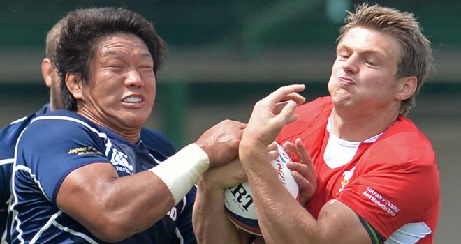 Takashi Kikutani tackles Dan Biggar during Wales' win over Japan last week