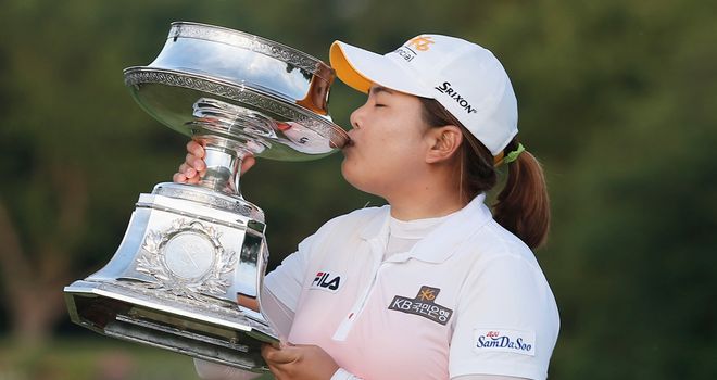 Inbee Park kisses the LPGA Championship trophy after a long day's work