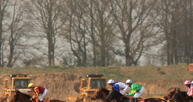 Racing takes place in front of construction equipment at Great Leighs