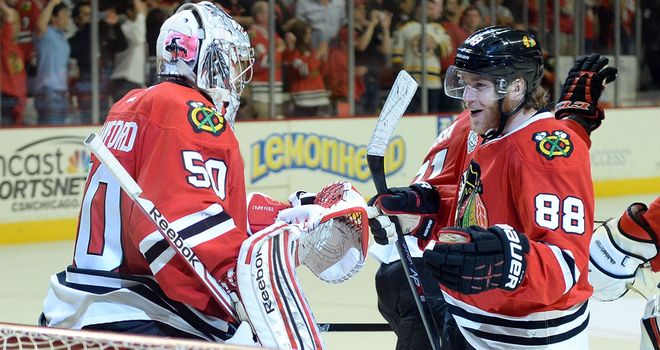 Patrick Kane celebrates with Chicago team-mate Corey Crawford