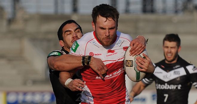 Macgraff Leuluai tackles Chris Heil of Hull KR in Super League earlier this season