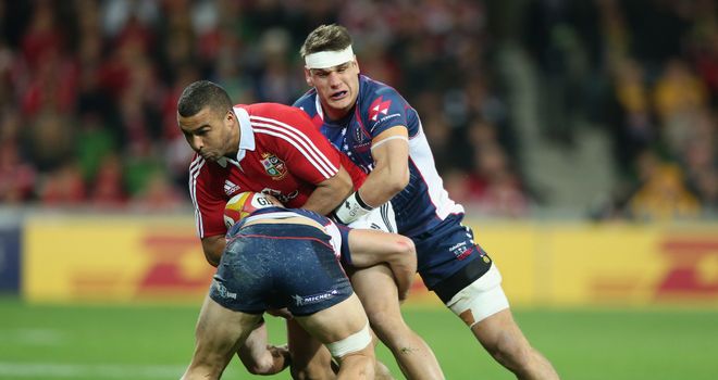 Lachlan Mitchell tackles Simon Zebo during the Rebels' game against the Lions