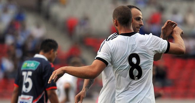 Dimitar Berbatov: Celebrates with Patjim Kasami in San Jose