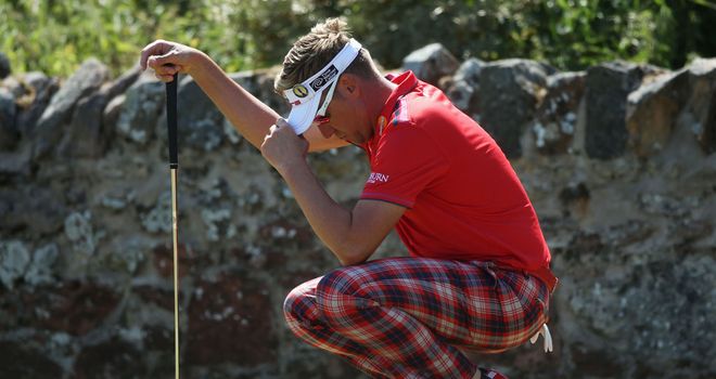 Ian Poulter can't bear to look as he ponders another quick putt at Muirfield