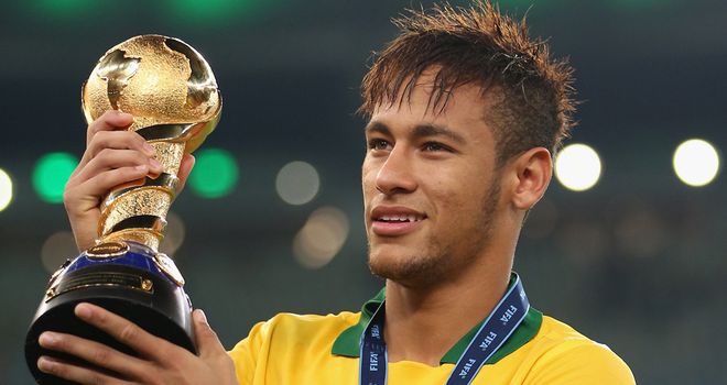 Neymar: Celebrates with the trophy after Brazil beat Spain 3-0