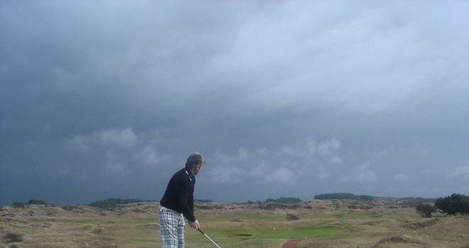 Matt prepares to tee off under darkening skies