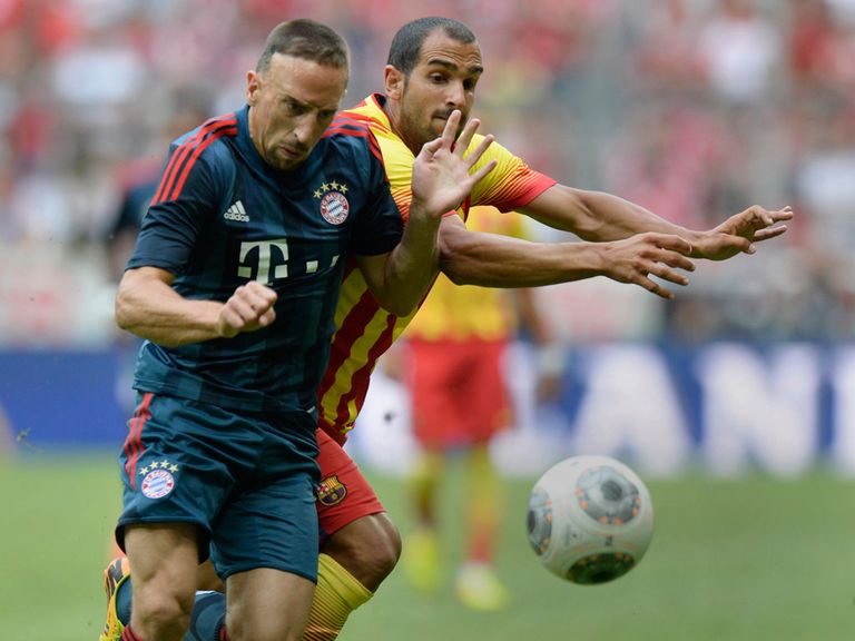 Franck Ribery and Martin Montoya battle for possession