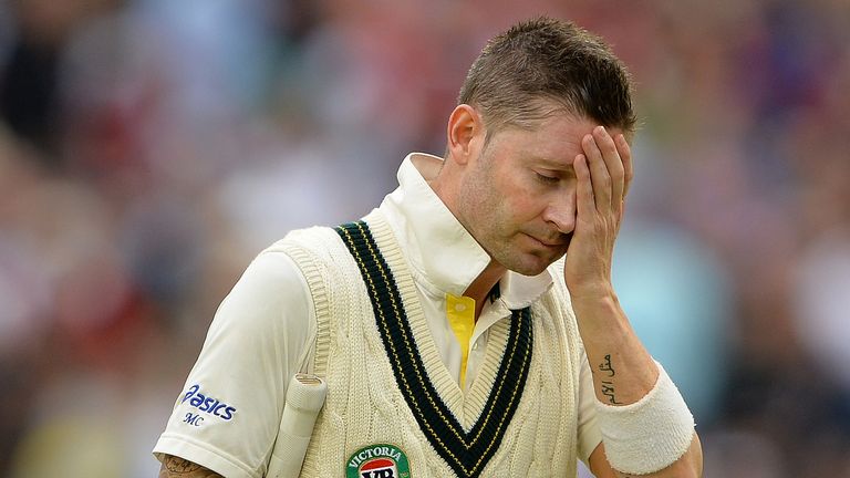 Michael Clarke sees the writing on the wall as he heads off due to bad light