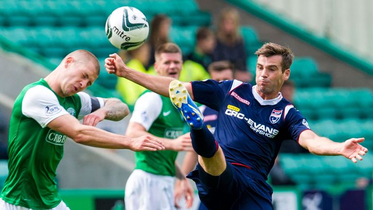 James Collins: Hibernian man battles with Ross County's Stuart Kettlewell