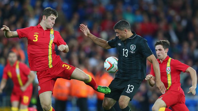 Republic of Ireland striker Jonathan Walters is challenged by Ben Davies