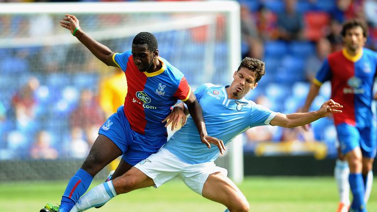 Yannick Bolasie of Palace competes for the ball with Hernanes of Lazio