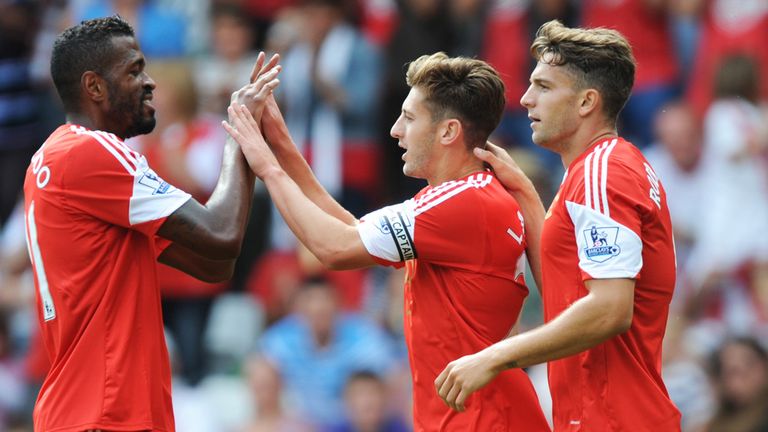 Adam Lallana celebrates with his Saints teammates