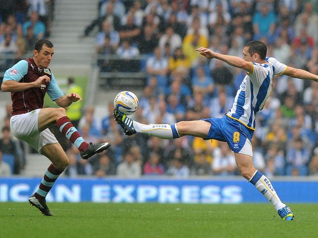 Dean Marney and Andrew Crofts tangle.