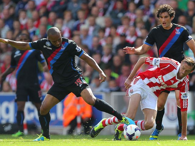 Gabbidon and Crouch keep focus on the ball.
