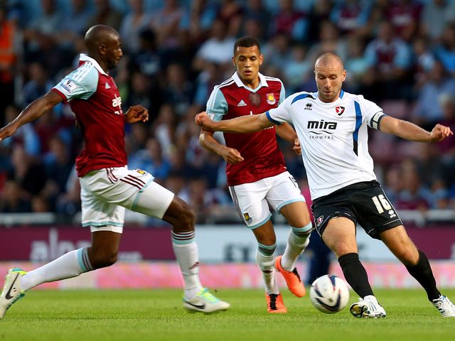 Russel Penn tries to get past Alou Diarra