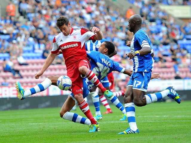 Lukas Jutkiewicz and James Perch battle for the ball