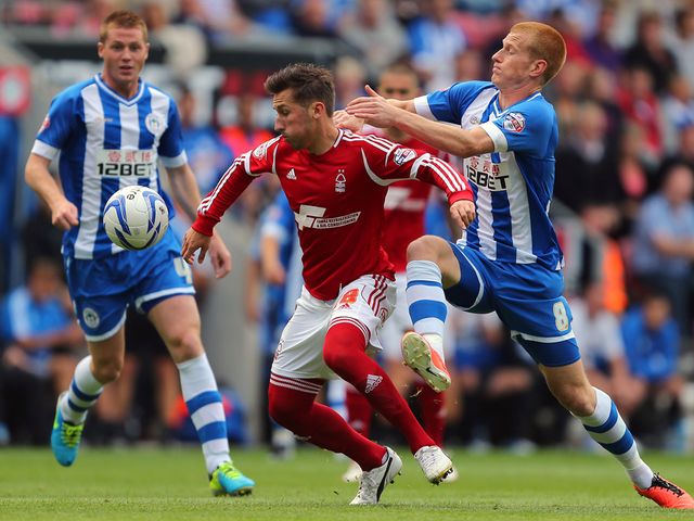 Radoslaw Majewski is put under pressure.