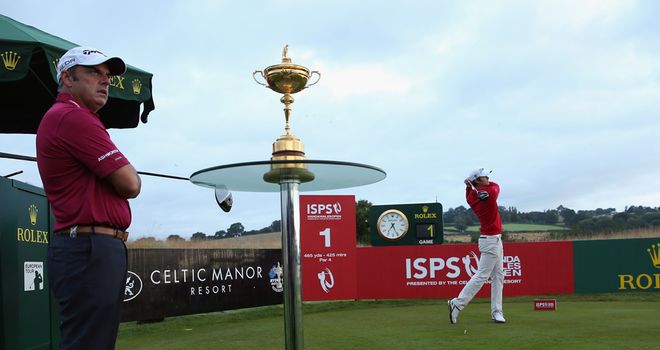 Espen Kofstad tees off with Paul McGinley watching