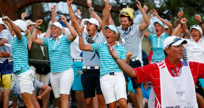 Europe celebrate Karine Icher's putt on the 18th.