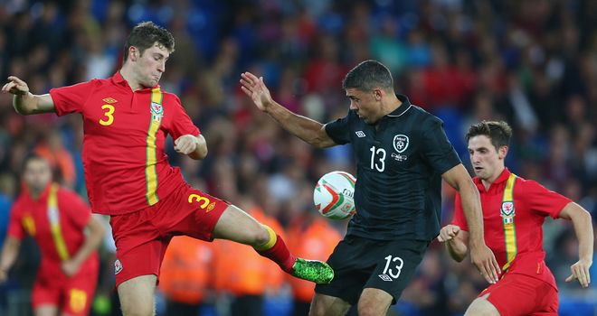 Republic of Ireland striker Jonathan Walters is challenged by Ben Davies