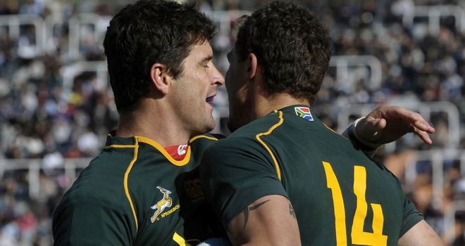 Morne Steyn celebrates with try-scorer Bjorn Basson (R)
